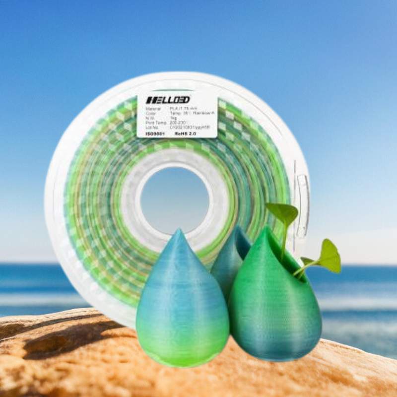 A green and blue spool of Filament - Hello3D PLA Temperature Change Colours 1.75mm 3D Printing Filament, with thermochromic magic, capable of changing colors with temperature variations.