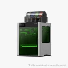The Bambu Lab H2D 3D Printer by Bambu Lab features a transparent green door, dual-nozzle 3D printing, and holds multiple filament spools on top. Note: Filaments are sold separately.