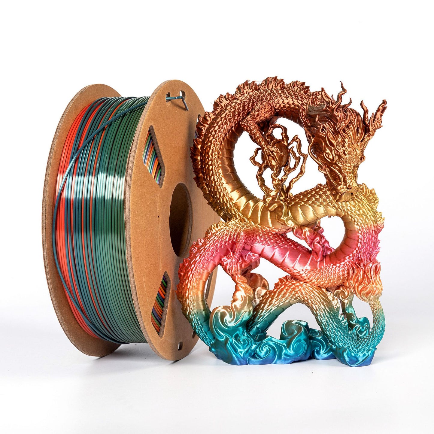 A spool of Toyar PLA Silk Rainbow 1.75mm 3D Printing Filament stands beside a vibrant, rainbow-colored PLA dragon sculpture on a white background.