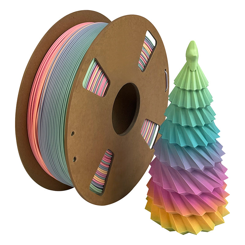 A spool of Toyar PLA Matte Rainbow 1.75mm Filament is beside a pastel, cone-shaped 3D print with layered colors like a stylized tree, showcasing Toyar's smooth matte finish.