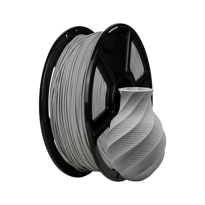 A spool of Flashforge PLA Matte 1.75mm 3D Printing Filament in gray is displayed beside a small, twisted-design vase 3D-printed in matching matte gray.