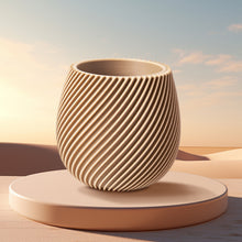 A round ceramic vase with diagonal ridges, 3D printed using Flashforge PLA Wood 1.75mm filament, is displayed on a circular platform against a soft, desert-inspired background.