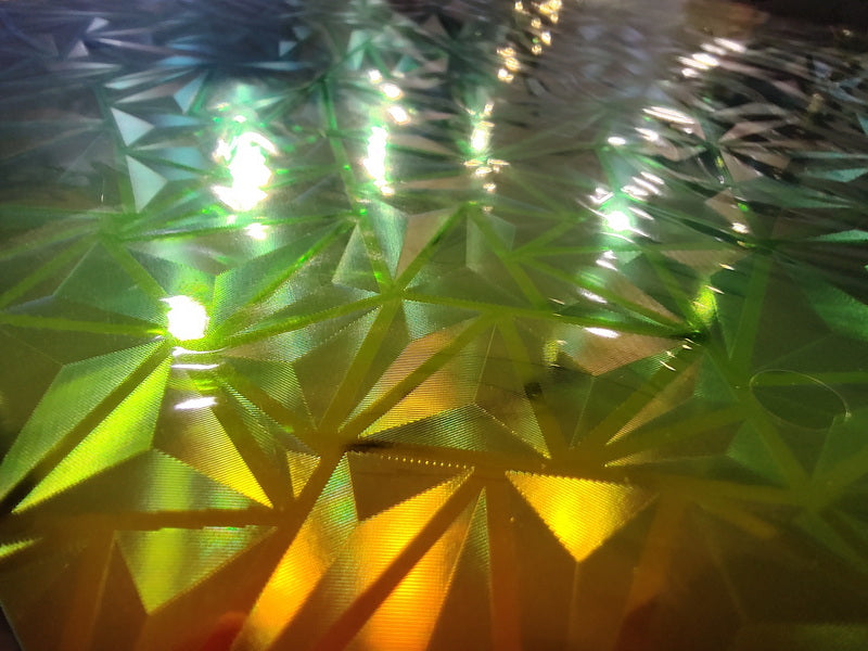 Close-up of the ASR Bambu Lab A1 Mini Steel Sheet Bed Platform (184x184mm) shows its geometric, double-sided PEI/PEO/PET color-changing surface with yellow and green reflections, highlighting precision and triangular patterns.