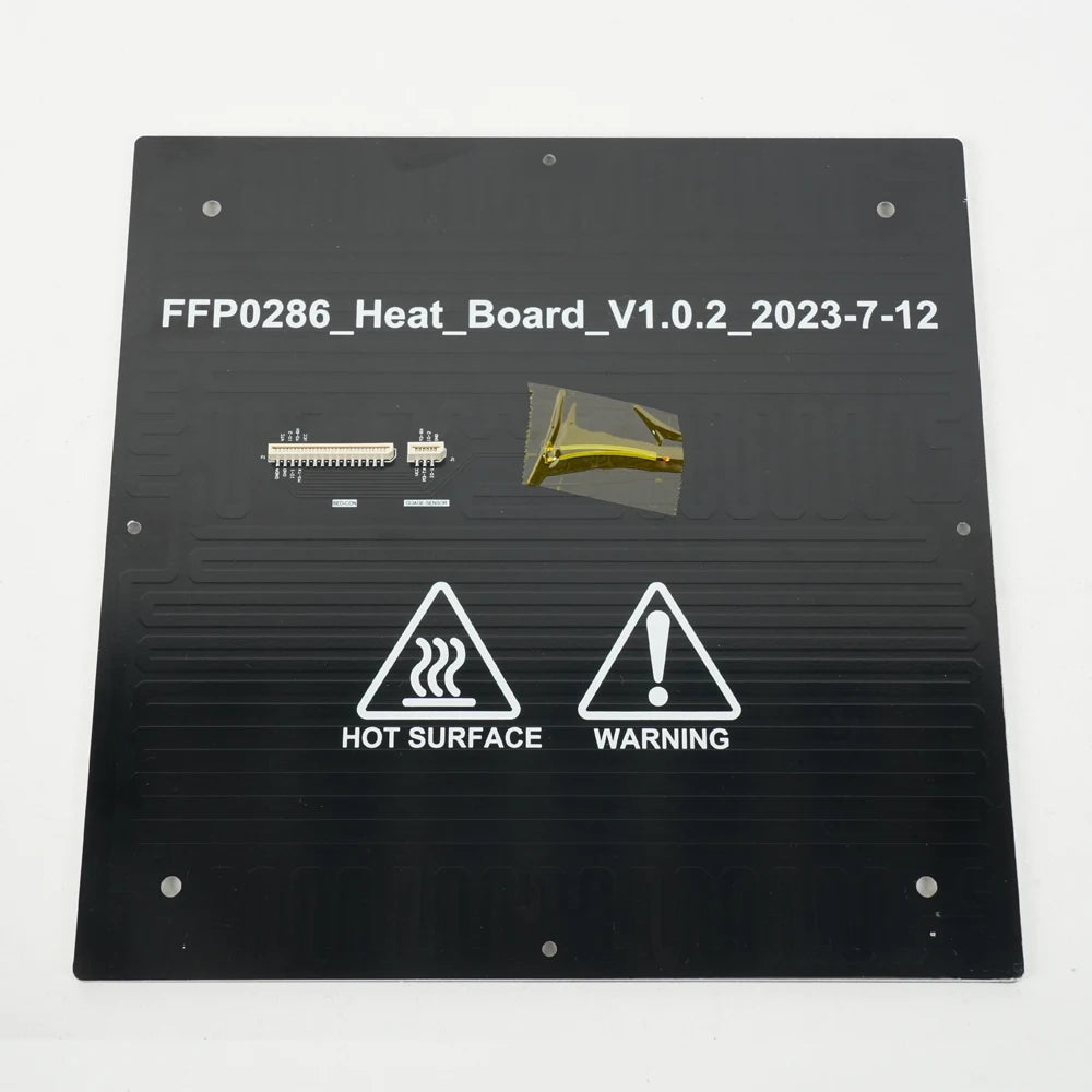 The Flashforge Adventurer 5M / 5M Pro Build Plate Heating Board is a black, rectangular heating board with caution icons and visible electronic components, designed by Flashforge for safe 3D printing on the Adventurer 5M series.