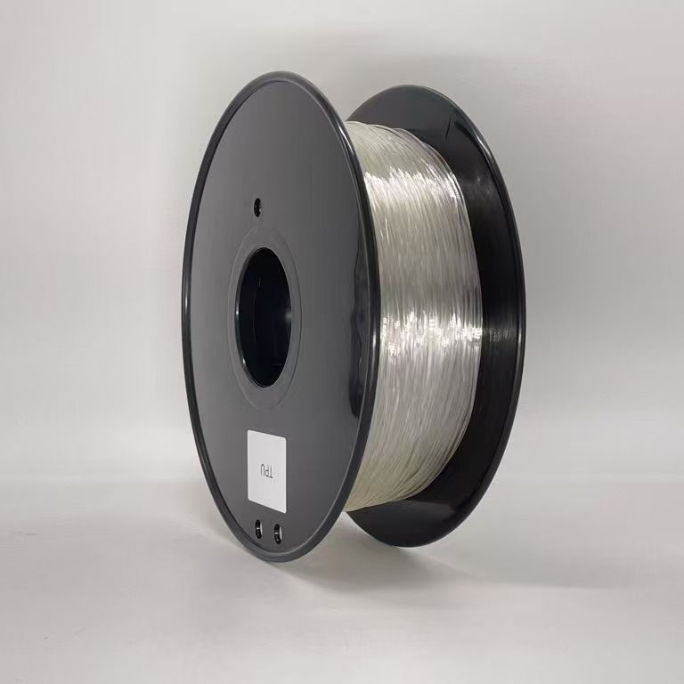 The Toyar TPU Transparent 1.75mm 3D Printing Filament comes on a black reel with a white label and is ideal for printing flexible objects.