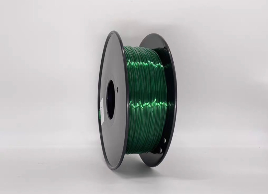 A spool of Toyar TPU Transparent 1.75mm 3D Printing Filament with black rims stands upright against a white background, perfect for 3D printing projects.