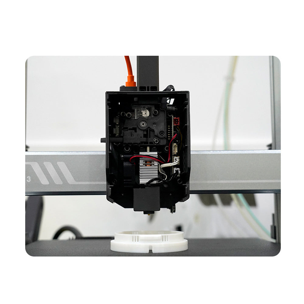 A 3D printer in action highlights the precision of the Anycubic Kobra 3, featuring a close-up of its extruder. The expertly designed 0.4mm brass nozzle by 3D Printing Perth - Cirrus Link operates seamlessly as wires trace its intricate maneuvers.