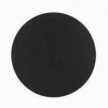 A round, plastic printing bed mat on a platform, being sold in Perth.