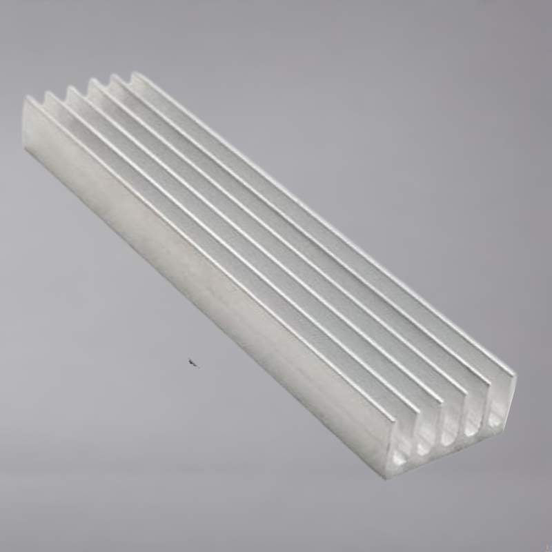 An aluminum heatsink on a gray background.