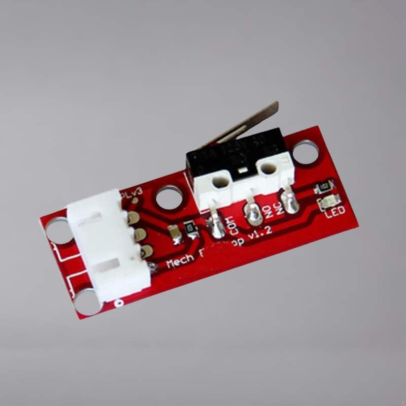 A red and white board with a small electronic component on it.