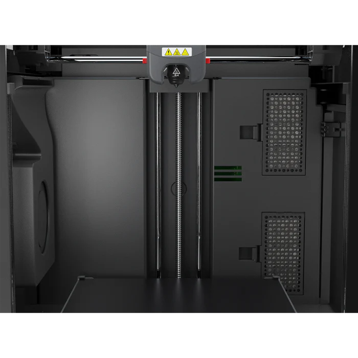 Close-up of the FlashForge Adventurer 5M Pro's interior, showing the print bed, vertical rails, extruder head, and control panels—by FlashForge. Quick setup and safe for home or school use.