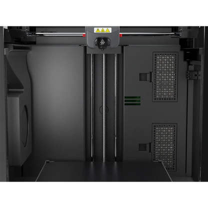Close-up of the FlashForge Adventurer 5M Pro's interior, showing the print bed, vertical rails, extruder head, and control panels—by FlashForge. Quick setup and safe for home or school use.