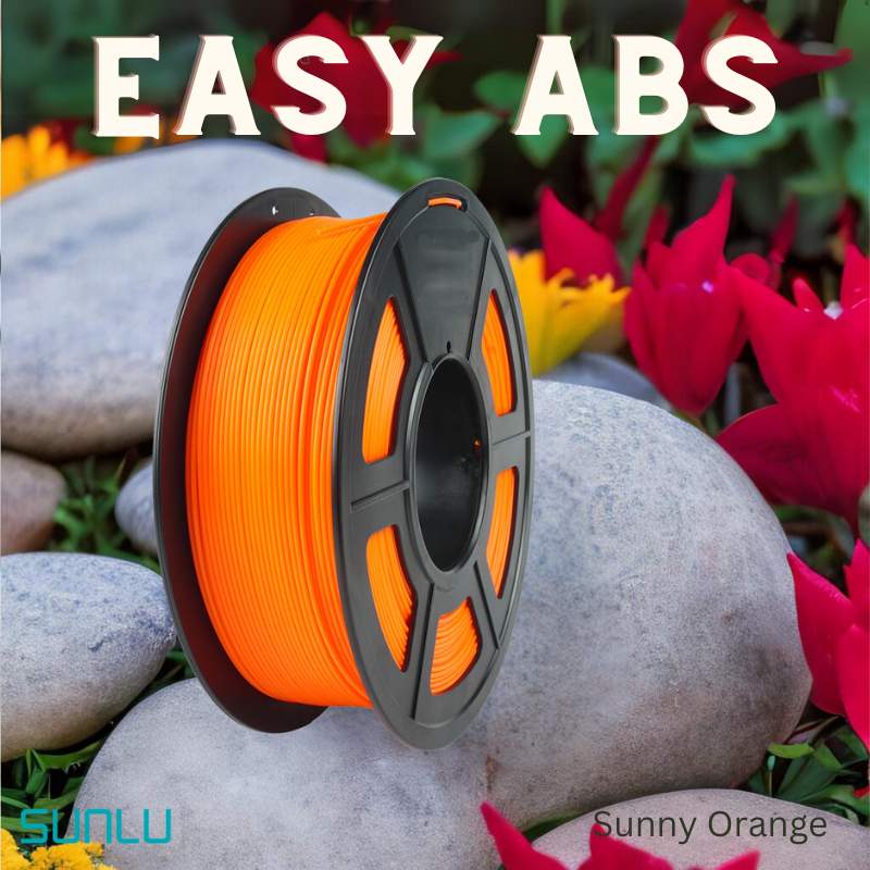 A spool of SUNLU Easy ABS 1.75mm 3D Printing Filament sits on smooth gray stones, with red and yellow flowers in the background.
