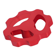 The red Motor Manual Nut by 3D Printing Perth - Cirrus Link is a durable metal component with a gear-like shape and three irregular cutouts, ensuring smooth E-axis extruder functionality.