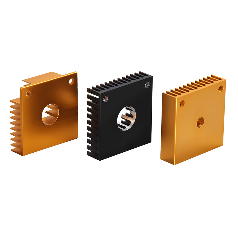 Three square MK7 MK8 Heat Sink 40x40x11mm units—two gold, one black—with finned edges and central holes by 3D Printing Perth - Cirrus Link stand upright, resembling 3D printer extruder assembly parts against a white background.