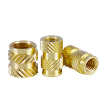 Displayed against a white background are four gold-colored Twill Knurled Copper Nuts with spiral grooves. Designed by 3D Printing Perth - Cirrus Link, these cylindrical threaded inserts enhance precision and stability in your 3D printing projects.