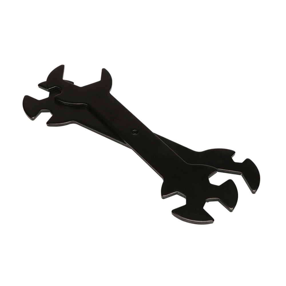A black wrench from 3D Printing Perth - Cirrus Link, designed with versatile ends to fit bolt sizes ranging from 6mm to 20mm, including compatibility with E3D MK8, MK10, and Volcano heat blocks, rests on a white surface. It is crafted to effortlessly manage tasks from handling nozzles to completing complex adjustments.