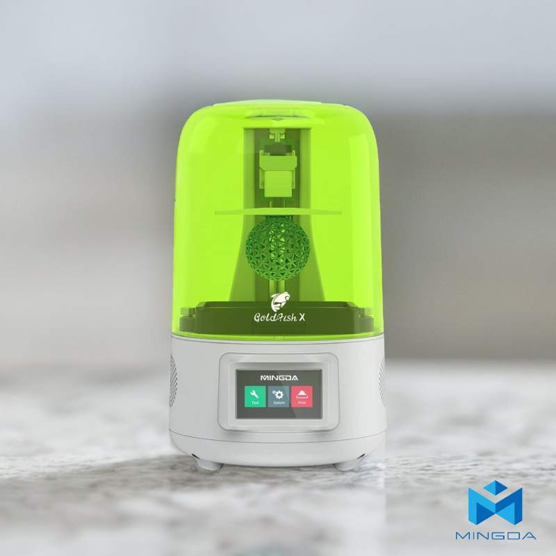 A green and white 3D Printer MINGDA Goldfish X 2K Resin Printer, sitting on top of a counter.