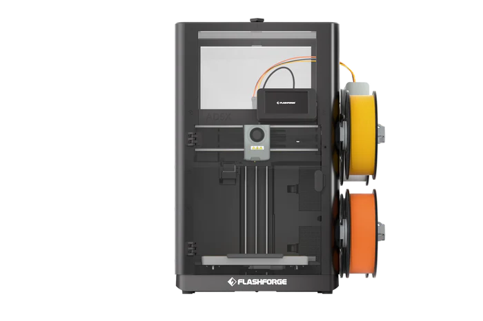 The FlashForge AD5X 3D printer with orange and yellow filament spools mounted on the right side achieves better temperature and safety control when paired with the FlashForge AD5X Printer Enclosure.
