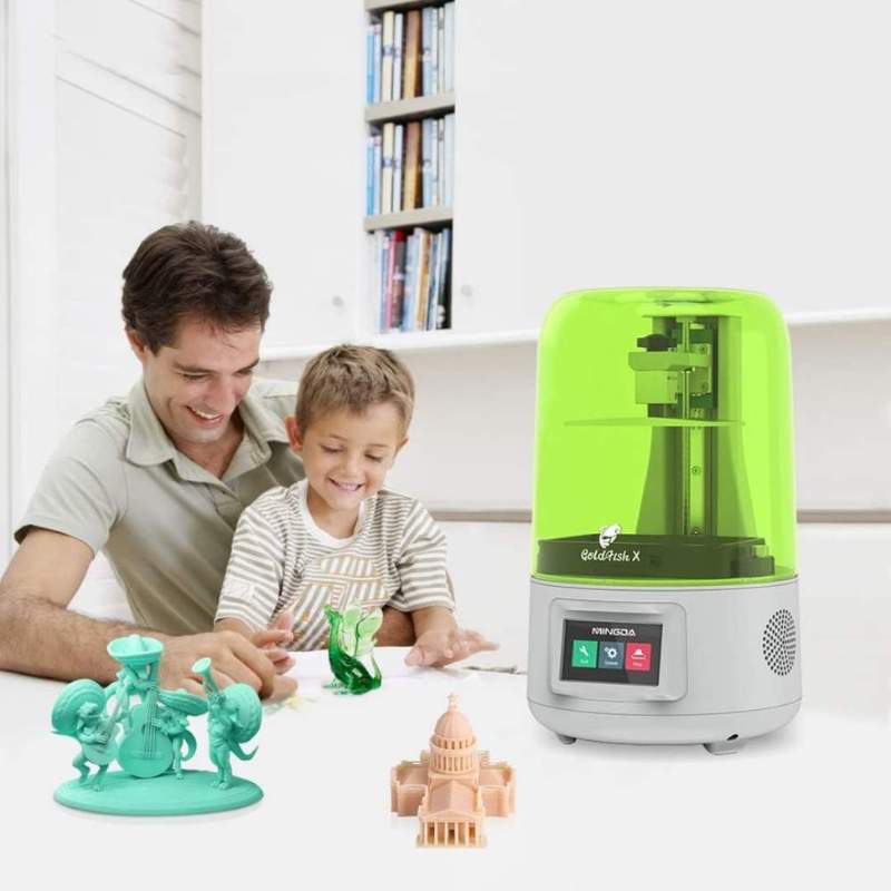 A man and a child are experimenting with a MINGDA 3D Printer Goldfish X 2K Resin Printer, indulging in the fascinating world of resin 3D printing.