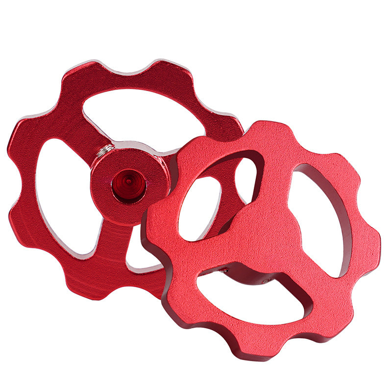 Two red, metallic gear-shaped Motor Manual Nuts for E-axis Extruder Hand Screw Nut 42 Stepper Motor D-axis from the brand 3D Printing Perth - Cirrus Link overlap, showcasing their smooth functionality and durability.