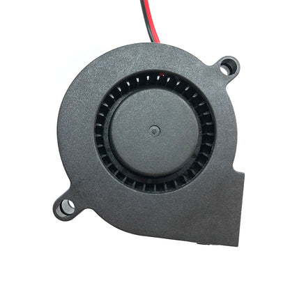 A compact Blower 5015 from 3D Printing Perth - Cirrus Link, featuring a black circular vent design, two mounting holes, and attached red and black wires. This 12V Dual Ball Bearing Fan operates at 6200 RPM with an airflow of 15 CFM and noise level of 33 DBA, making it an efficient cooling solution for 3D printing projects.