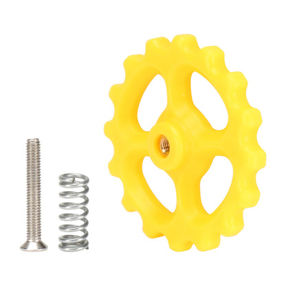 A yellow gear wheel, along with components from the M3X20X44 Hot Bed Leveling Spring Kit by 3D Printing Perth - Cirrus Link, elegantly rests on a white background, reminiscent of 3D printer parts.