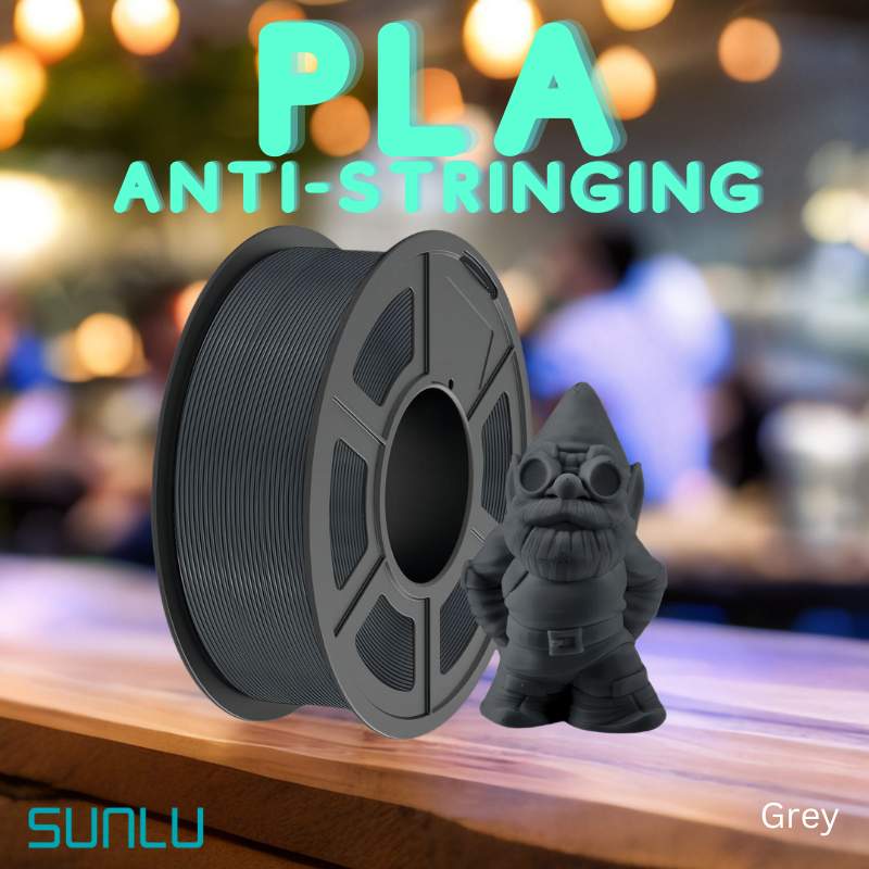 A teddy bear is sitting on a table next to a spool of SUNLU APLA 1.75mm 3D Printing Filament.