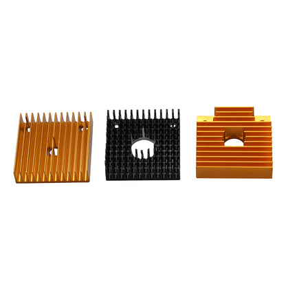 Three 3D Printing Perth - Cirrus Link MK7 MK8 Heat Sink 40x40x11mm units—two gold, one black—are shown in a row, each with unique fin designs and central holes, perfect for 3D printer extruders.