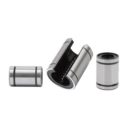 Displayed are three Linear Ball Bearings by 3D Printing Perth - Cirrus Link; two cylindrical and one open to reveal internal components, exemplifying CNC machining precision.