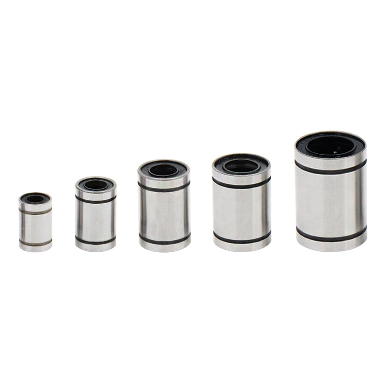 Five varying-sized linear ball bearings from 3D Printing Perth - Cirrus Link, neatly arranged in a row against a white background, showcasing precision akin to CNC machining.