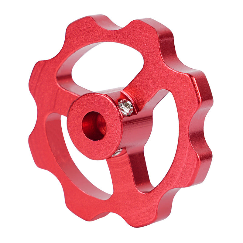 The Motor Manual Nut for E-axis Extruder Hand Screw Nut 42 Stepper Motor by 3D Printing Perth - Cirrus Link is a red metal gear-shaped component with a central hole and eight rounded teeth, designed for durability and reliability in intricate mechanical systems.