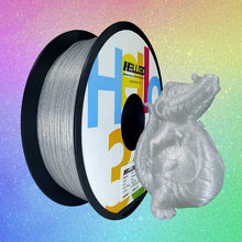 A spool of Hello3D silver PLA filament with a crocodile figurine, shining bright.
