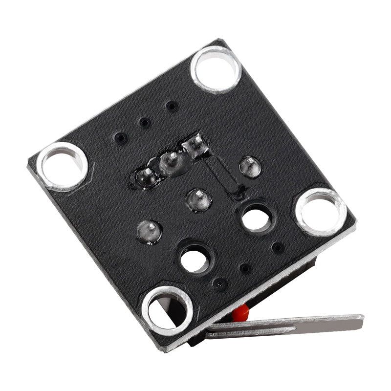 A square electronic component with four mounting holes and metal contacts on a black surface, similar to the EndStop Switch for CR-10 Ender-3S Mechanical Limit Micro Stroke by 3D Printing Perth - Cirrus Link, is crucial for achieving precision in 3D printing projects.