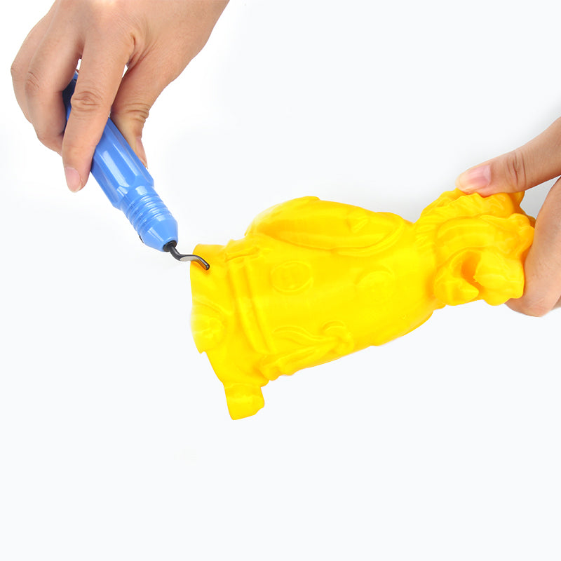 The hands adeptly maneuver a blue 3D printing pen to craft a yellow toy-like figurine against a white backdrop, highlighting the precision of the 3D Printing Model Deburring Cutter Head and Hand-made Polishing Tool with Detachable Blade by 3D Printing Perth - Cirrus Link.