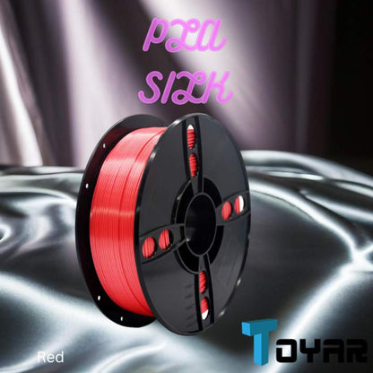 A red spool of Toyar PLA Silk Standard Colour 1.75mm 3D Printing Filament for 3D printing on a silver surface.