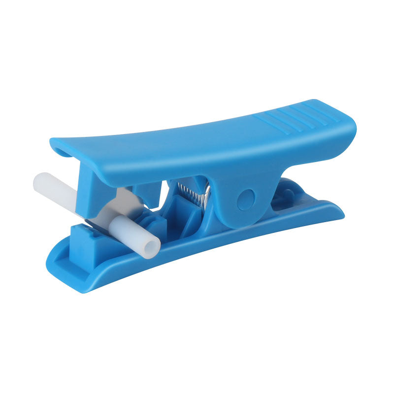 The PTFE Teflon Tube Cutter by 3D Printing Perth - Cirrus Link, crafted from blue plastic with a spring mechanism for versatile usage, elegantly holds a white toothbrush.