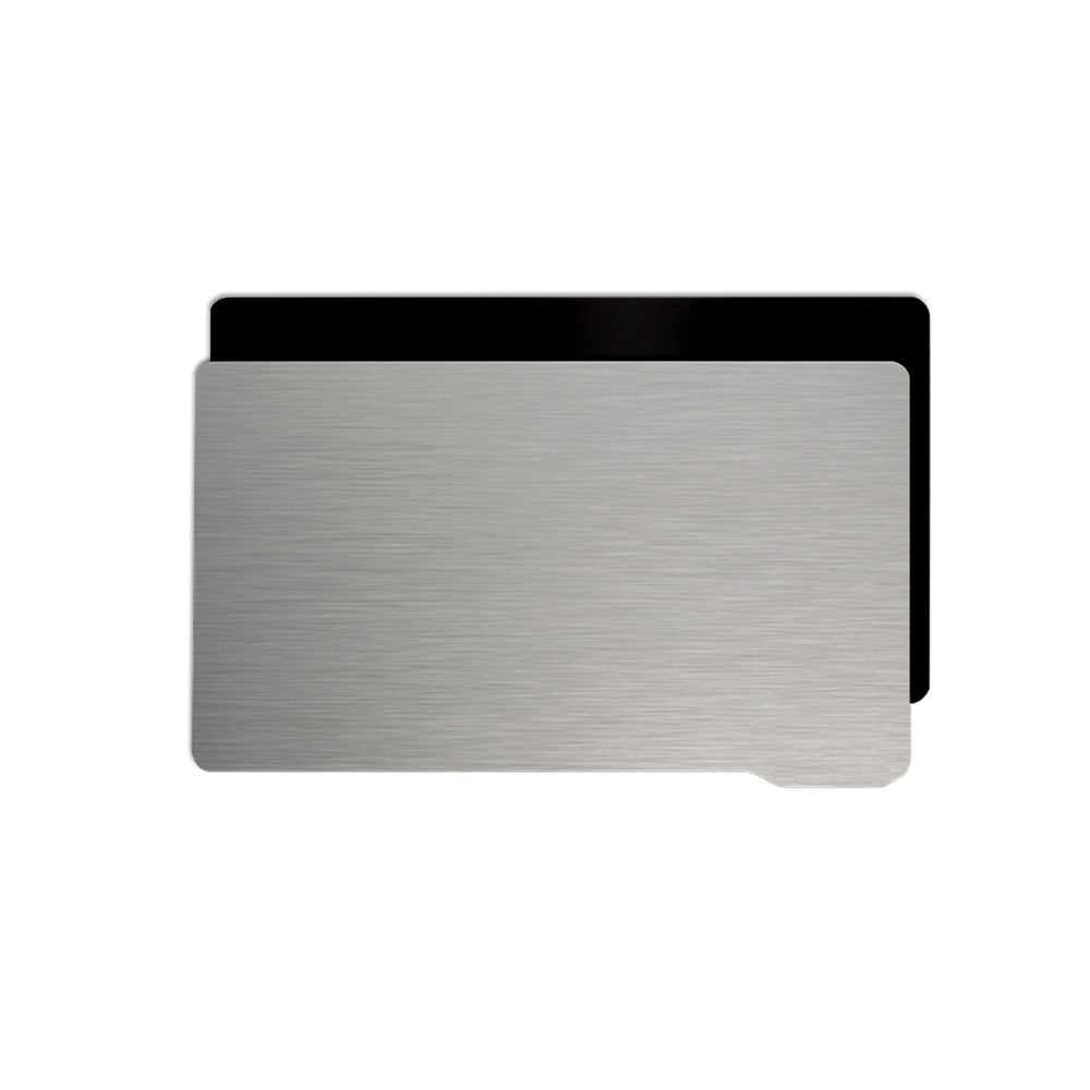 A textured silver card, reminiscent of a 3D Printing Perth SLA/DLP/LCD Steel Sheet Film for resin printers, partially conceals a plain black card in the background.