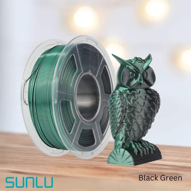 A spool of eco-friendly SUNLU PLA+ Silk Dual Colour 1.75mm 3D Printing Filament next to an owl statue.