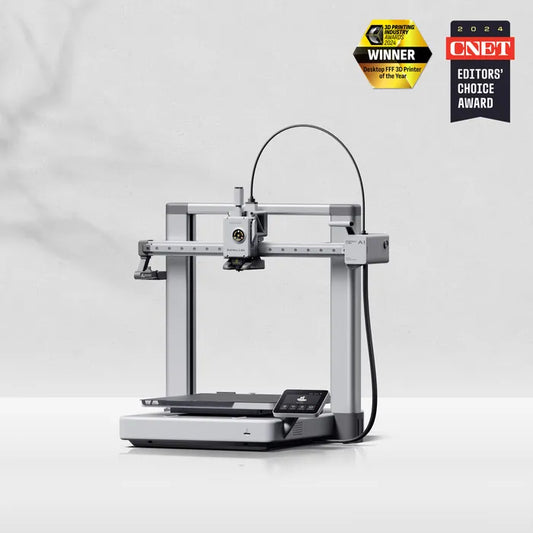 The Bambu Lab A1 3D Printer by Bambu Lab sits on a white surface, offering full-auto calibration, with two award badges in the top-right corner: "Best 3D Printer of the Year" and "CNET Editors' Choice Award 2024.