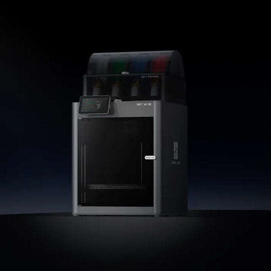 The Bambu Lab X1E 3D Printer by Bambu Lab, in black with a transparent top cover and touchscreen display, stands against a dark background and features CoreXY motion technology for enhanced precision.