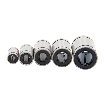 Five 3D Printing Perth - Cirrus Link Linear Ball Bearings of varying sizes are lined up, ideal for precision CNC machining projects.