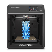 The FlashForge Adventurer 5M Pro, a fast-printing 3D printer from FlashForge, is printing a blue, leaf-like sculpture inside its enclosed chamber.