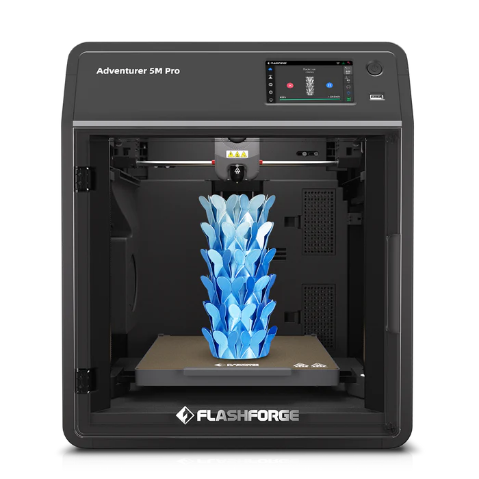 The FlashForge Adventurer 5M Pro, a fast-printing 3D printer from FlashForge, is printing a blue, leaf-like sculpture inside its enclosed chamber.