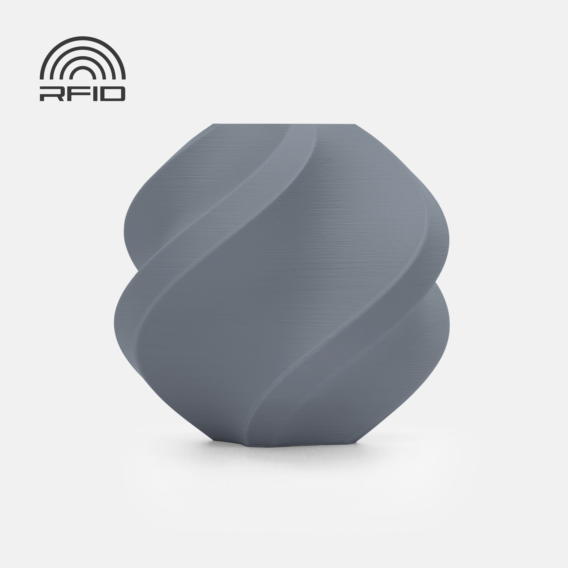A gray, geometric spiral vase made with BambuLab Filament Matte by 3D Printing Perth - Cirrus Link sits on a white background, featuring an RFID symbol in the top left corner.
