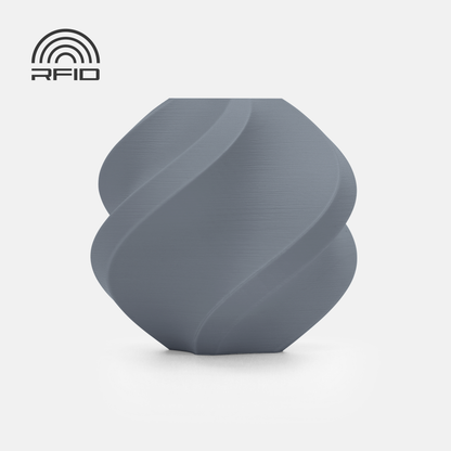A gray, geometric spiral vase made with BambuLab Filament Matte by 3D Printing Perth - Cirrus Link sits on a white background, featuring an RFID symbol in the top left corner.