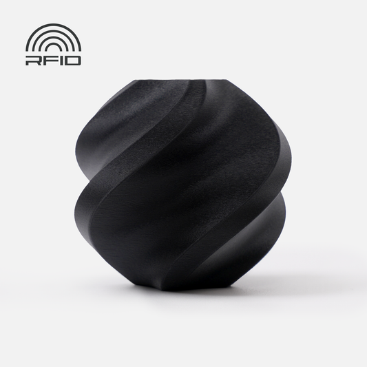 A matte black, spiral-shaped object 3D printed with 1.75mm BambuLab Filament Matte from 3D Printing Perth - Cirrus Link is shown on a white background, featuring a smooth surface and an RFID logo in the top left corner.