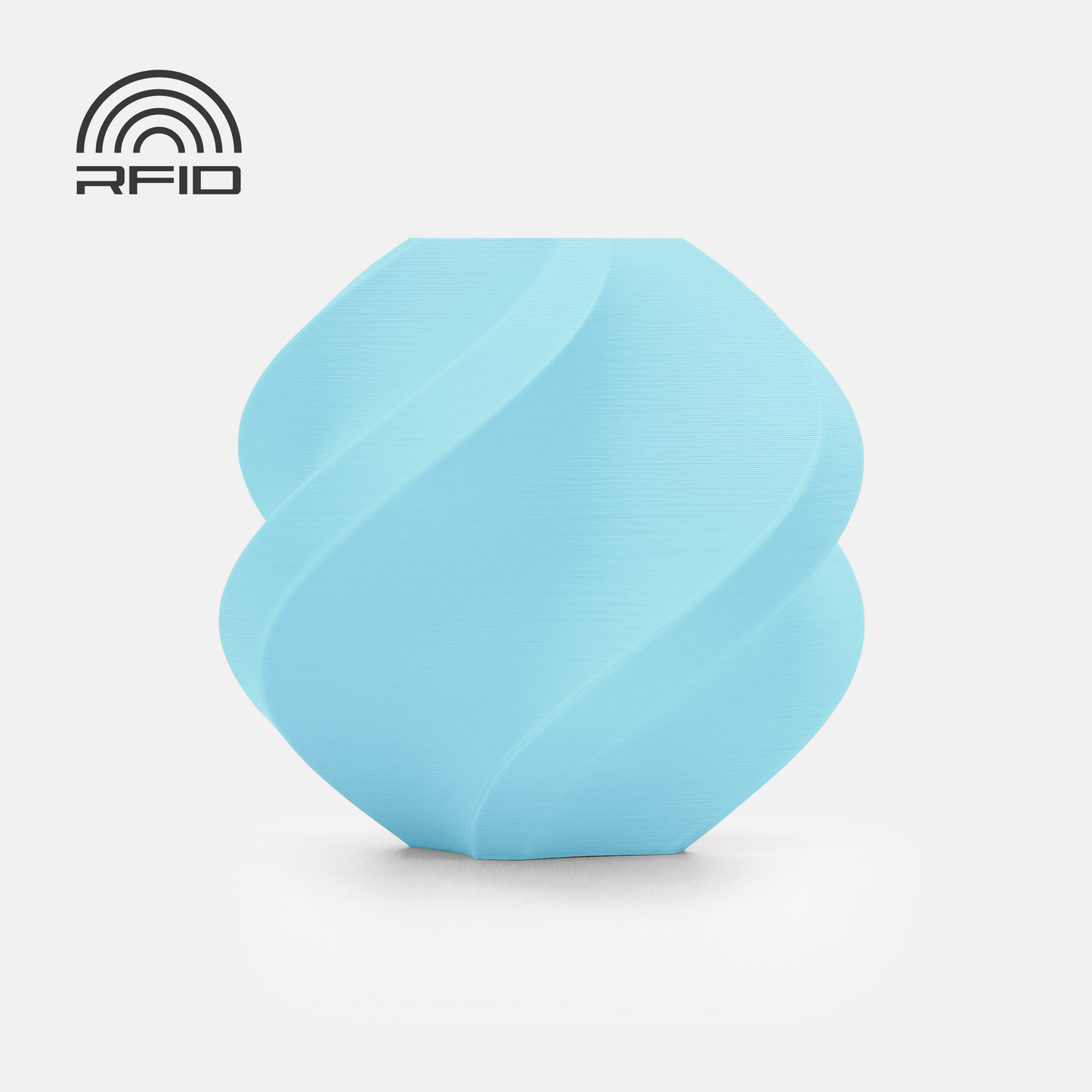 A light blue, rounded BambuLab Filament Matte by 3D Printing Perth - Cirrus Link is shown with a spiral design on a white background, featuring an RFID icon. This beginner-friendly 1.75mm filament is ideal for eco-conscious users seeking biodegradable options.