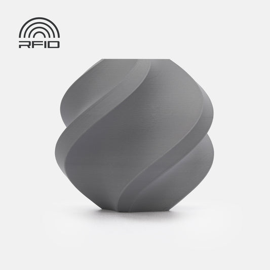 A gray, smooth, spiral-shaped BambuLab Filament Matte by 3D Printing Perth - Cirrus Link with a matte finish is displayed on a white background, featuring an RFID symbol in the top left corner.