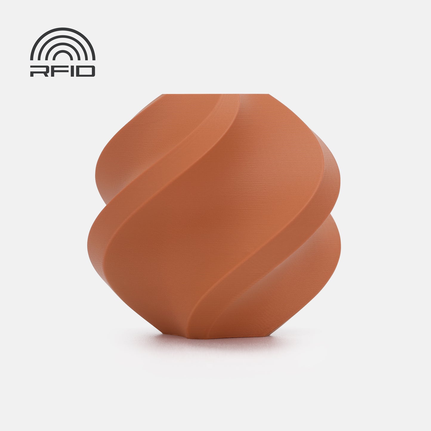 A brown, spiral-shaped object made from BambuLab Filament Matte by 3D Printing Perth - Cirrus Link (1.75mm) is displayed against a white background with an RFID logo in the top left corner.